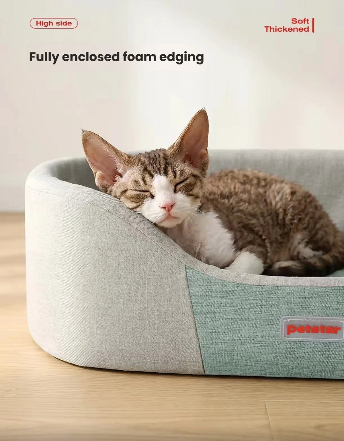 Close-up of a cat resting against the bed’s raised padded edge