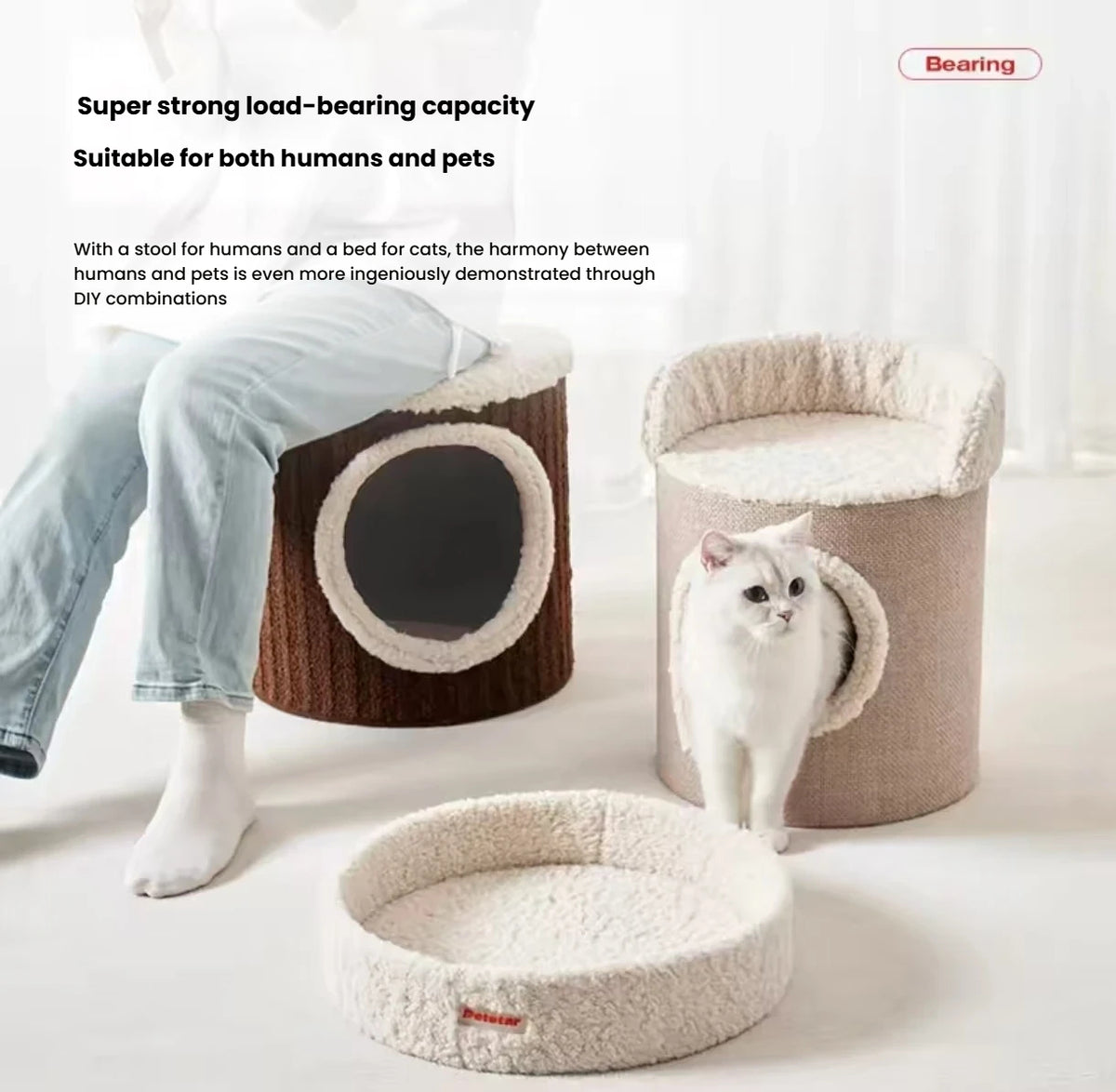 Petstar modular cat house sections separated beside a seated person