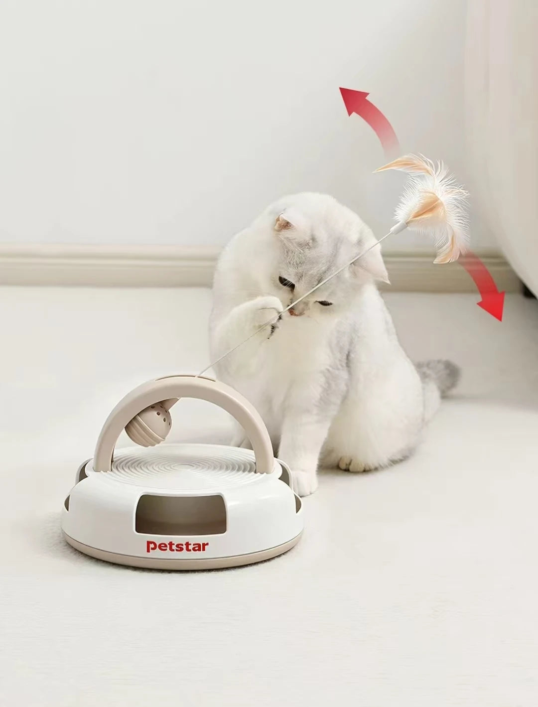 Cat batting the feather wand on a Petstar activity toy