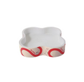 Flower-shaped Petstar cat scratcher bed with pale interior and red printed sides