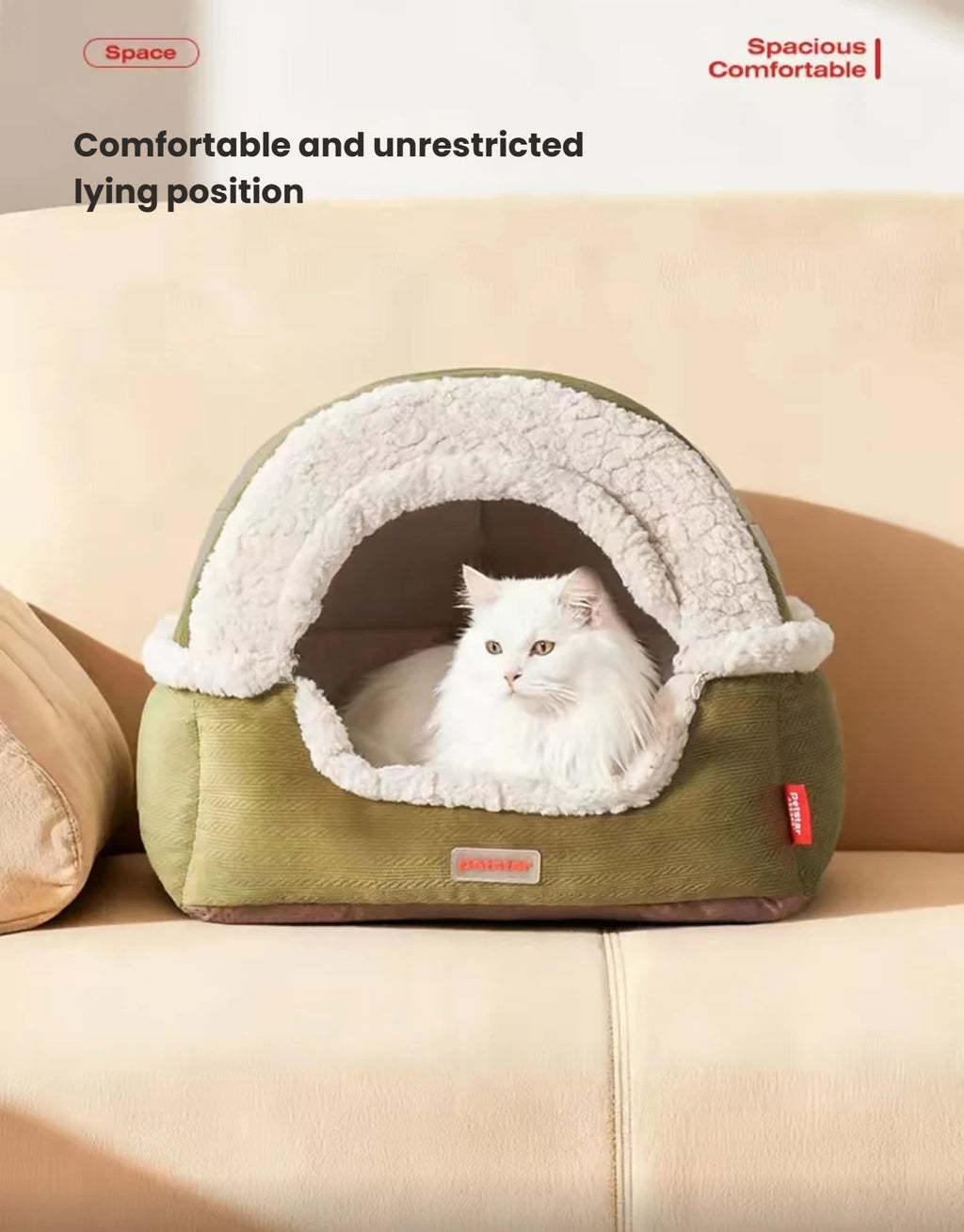 White cat looking out from the cream-lined Petstar cat cave