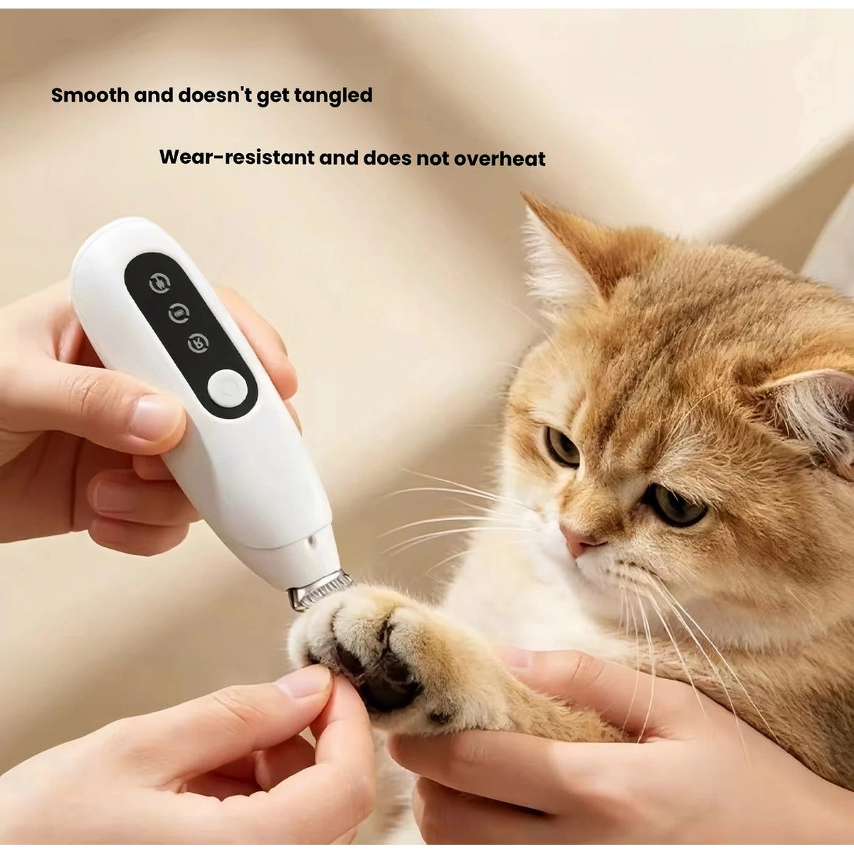 White pet trimmer being used near a cat paw