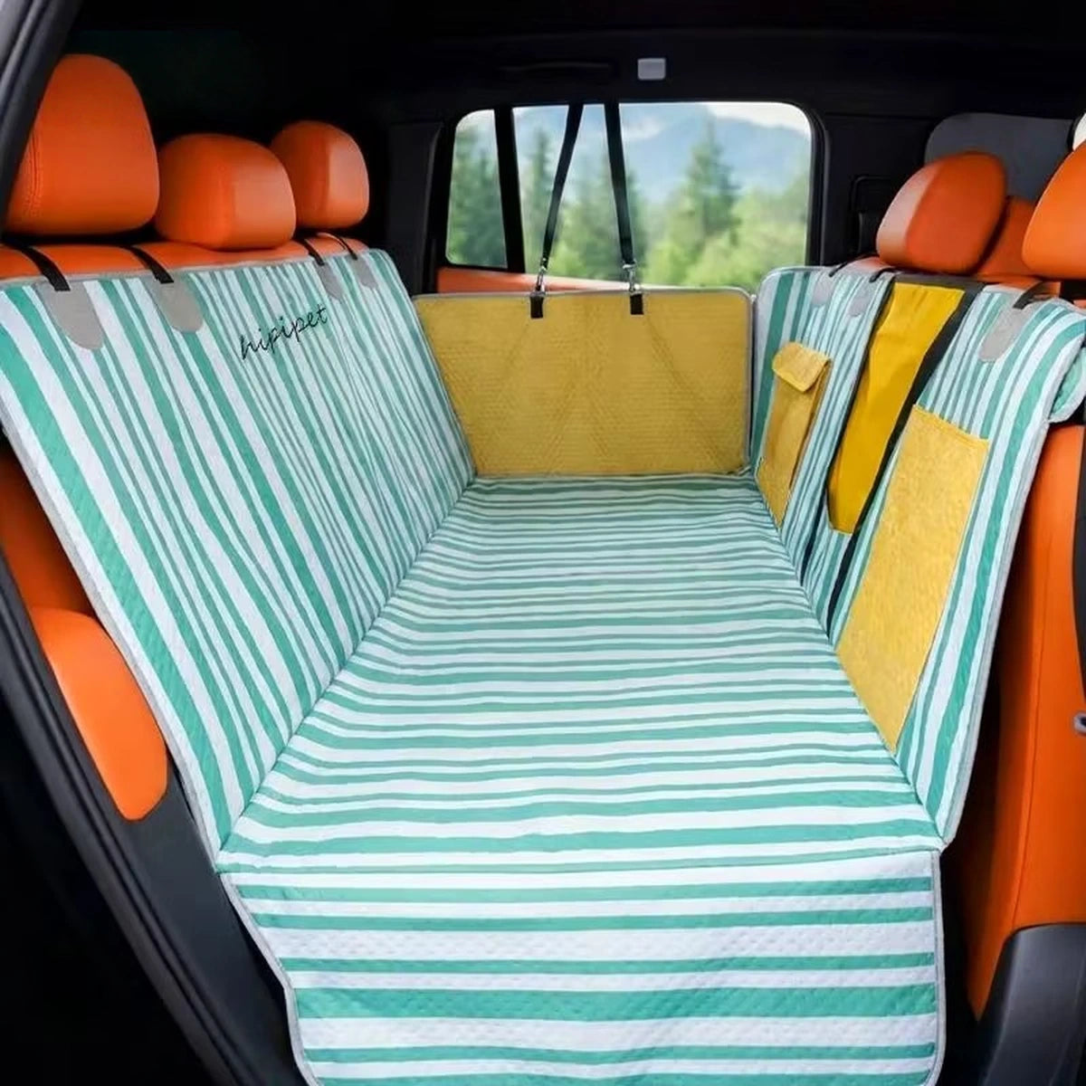 Striped dog car seat cover fitted across a vehicle back seat