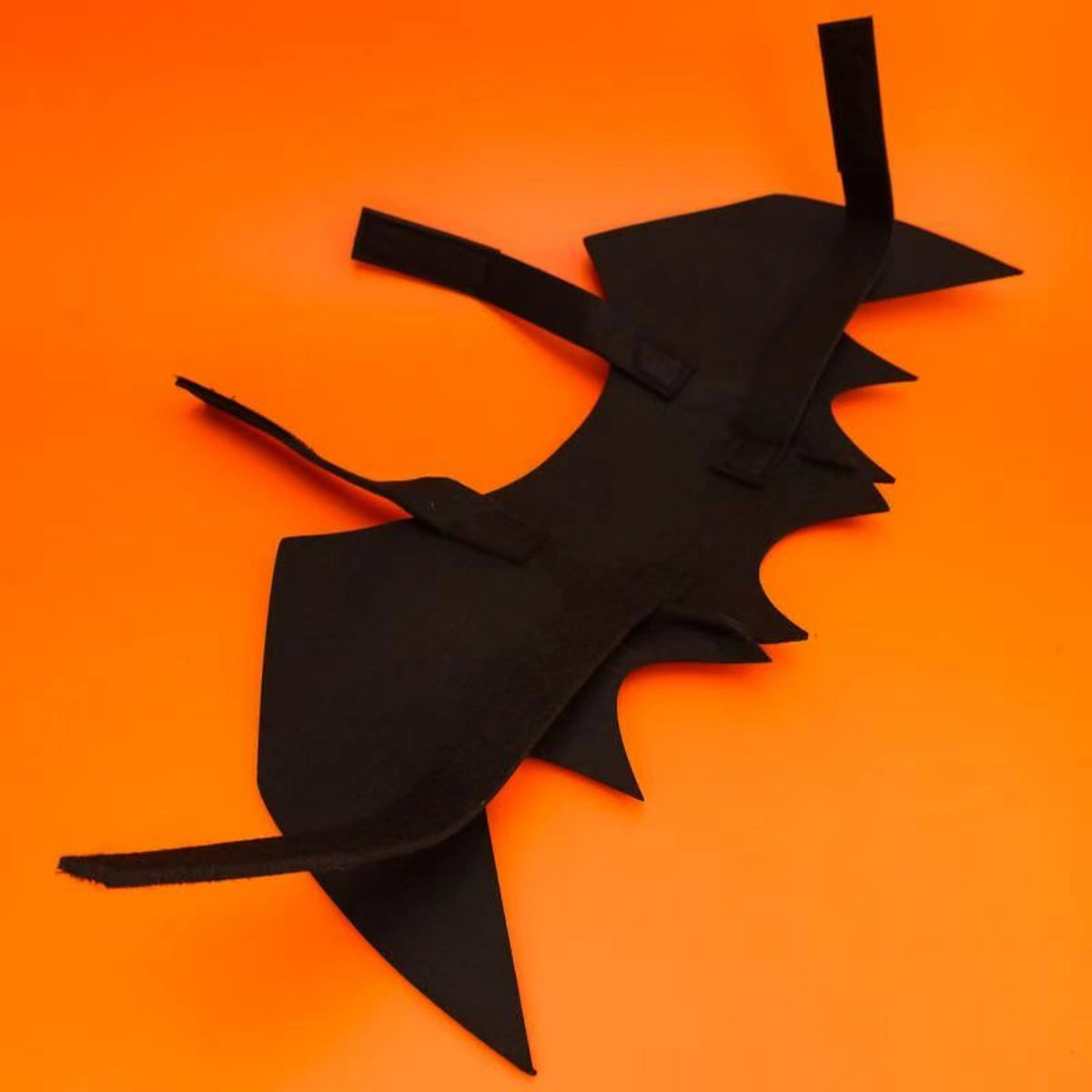 Black bat-wing costume viewed from rear
