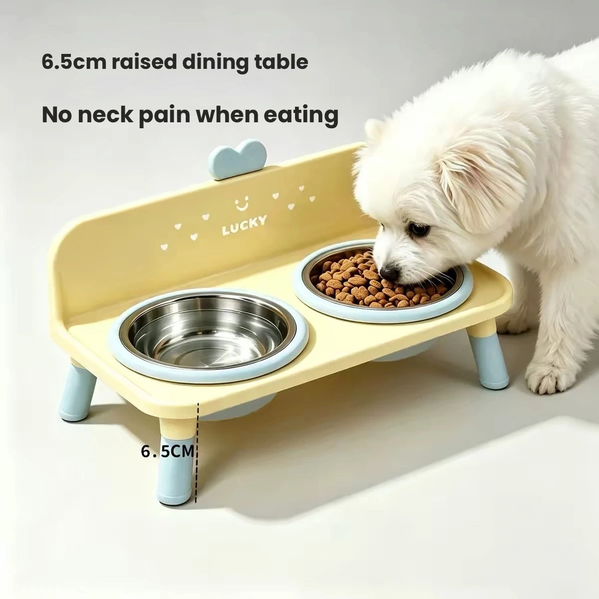 Small dog eating from yellow two-bowl feeder