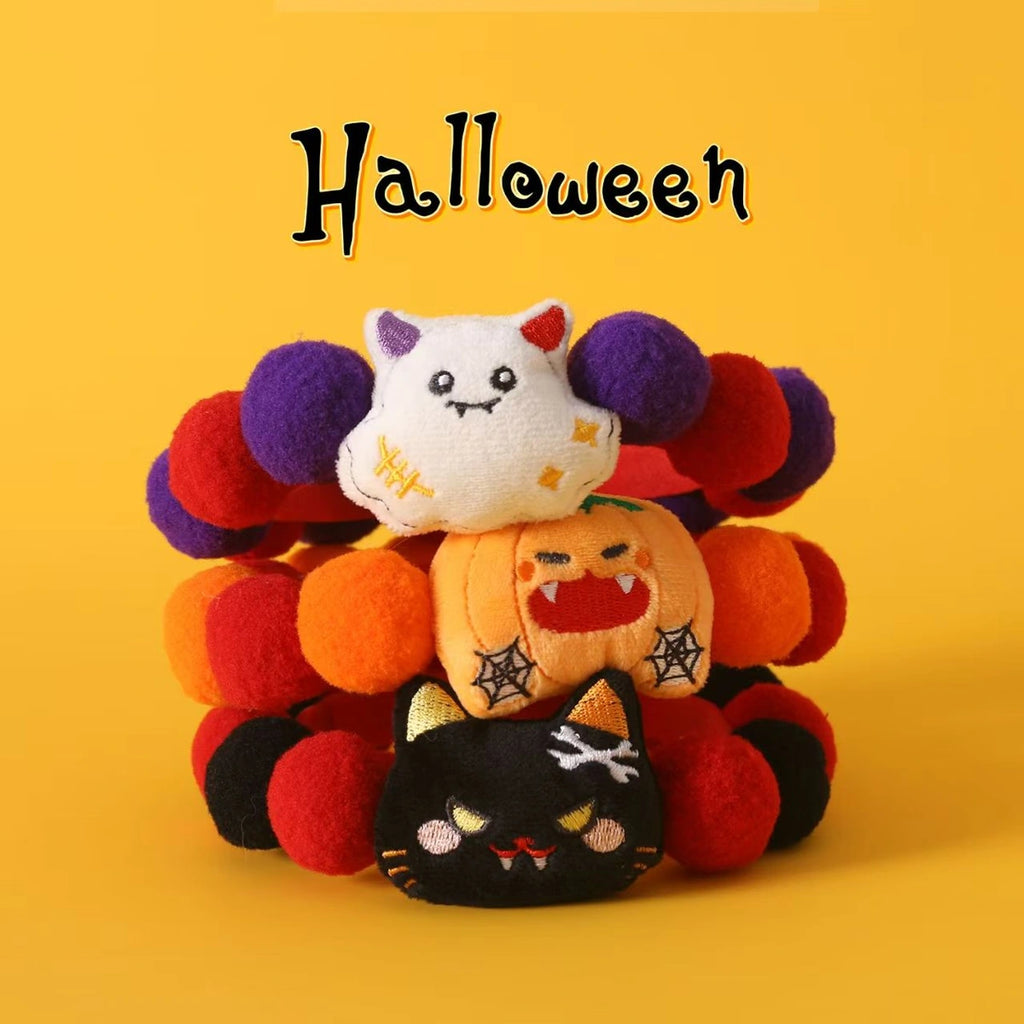 Pumpkin and ghost pet collar on Halloween display