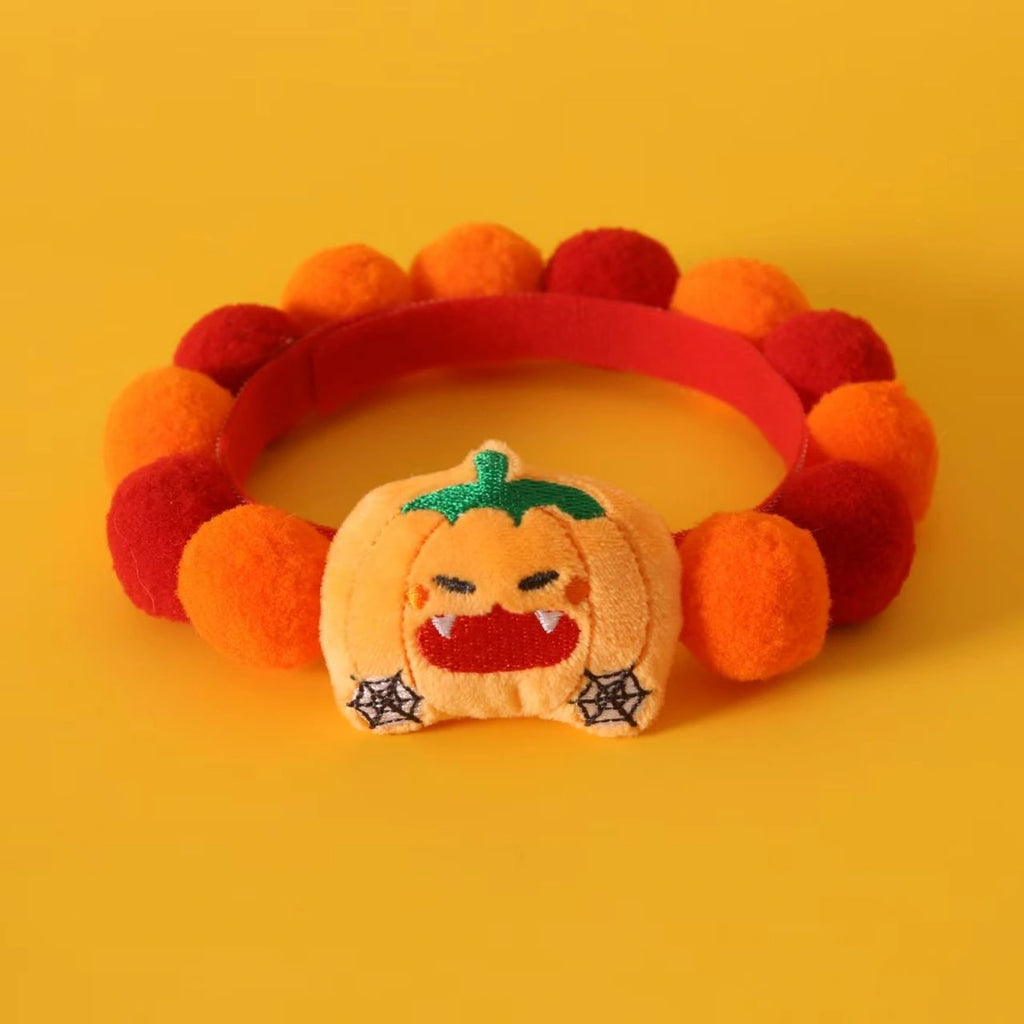 Orange and red pumpkin pet collar laid flat