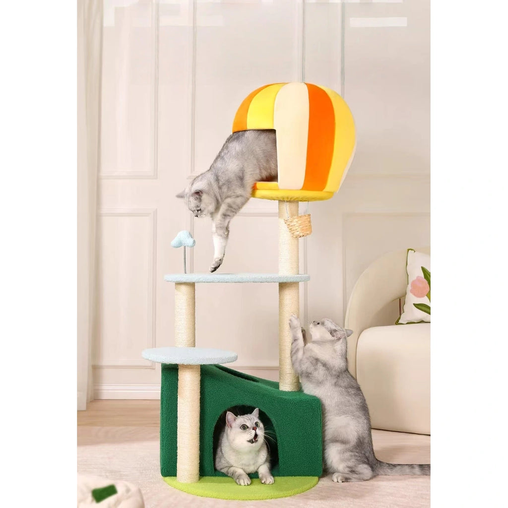 Cat climbing the pale blue UFBemo cat tree