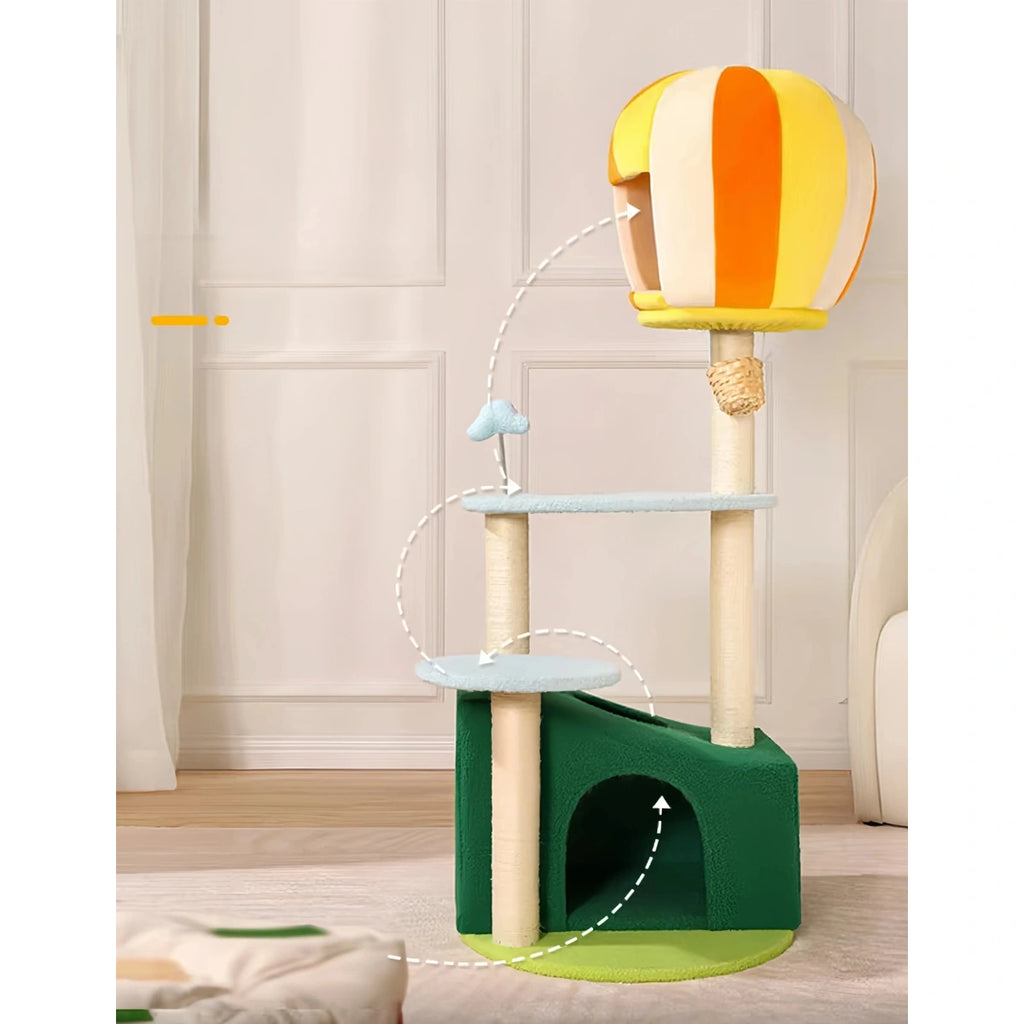 Green UFBemo cat tree standing in a room with a cat nearby