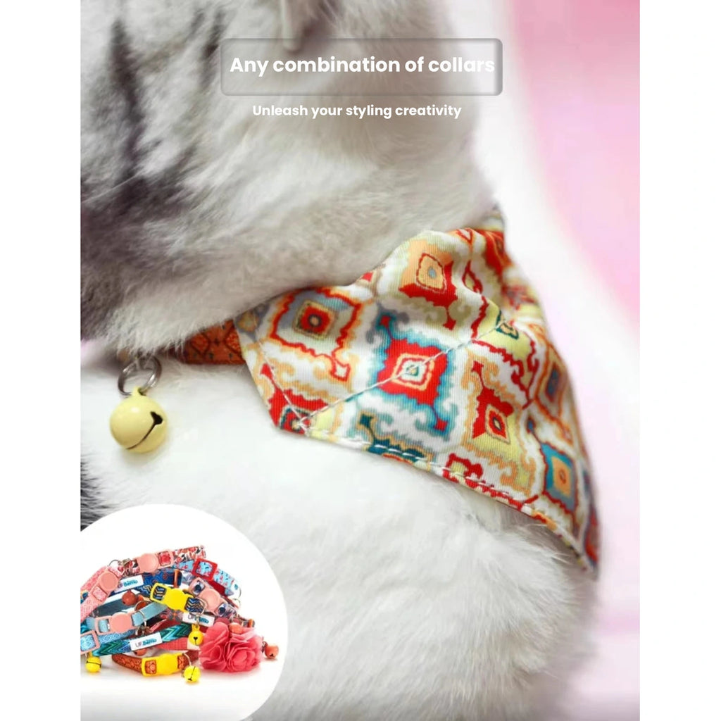 Cat wearing a patterned UFBemo bandana collar from the side