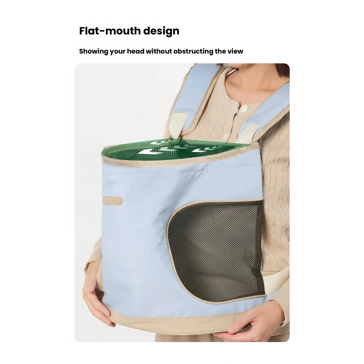 Top opening of blue carrier bag while worn in front