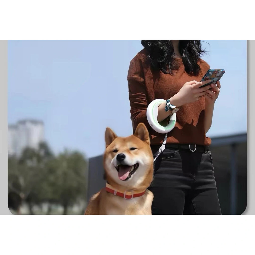 Person walking a dog with white Moestar UFO leash