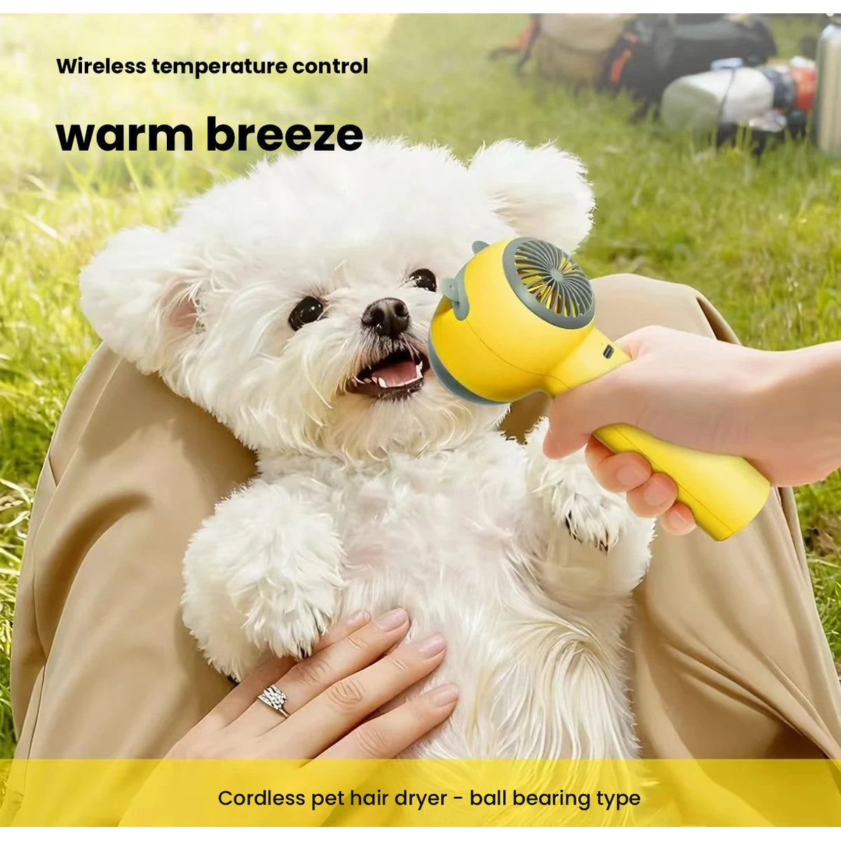 Yellow pet dryer used beside a small white dog