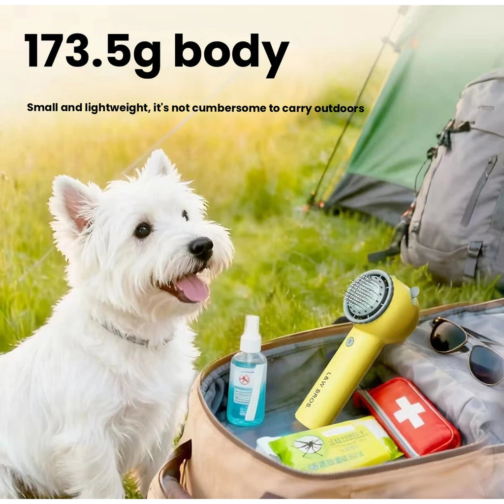 Yellow pet dryer and grooming accessories beside dog