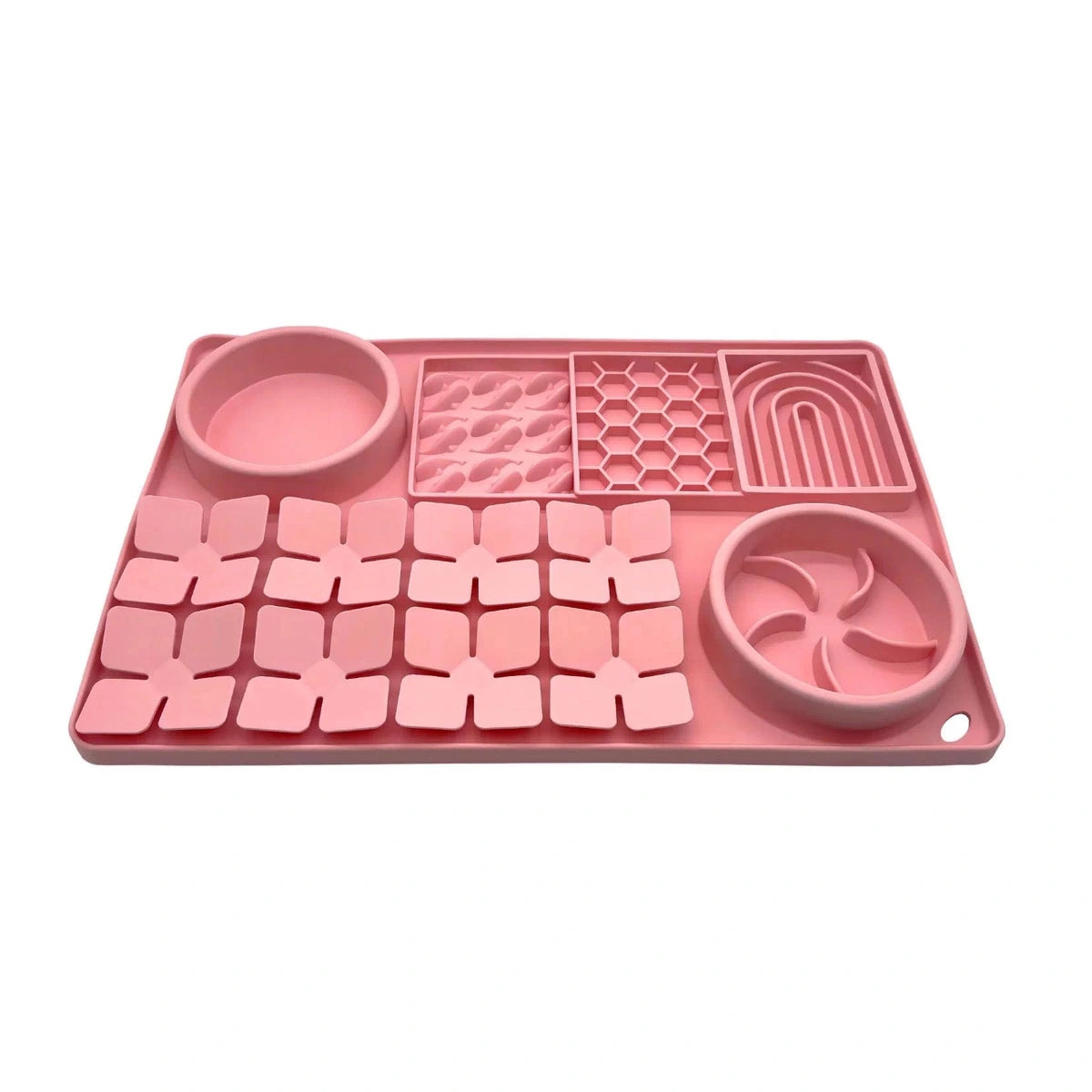 Pink silicone slow feeder mat with textured sections