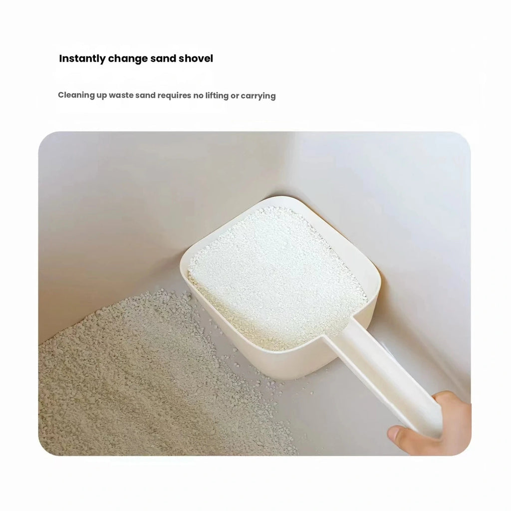Cream Meoof litter scoop viewed from underneath