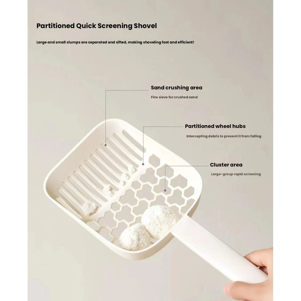 Hand holding cream Meoof slotted cat litter scoop