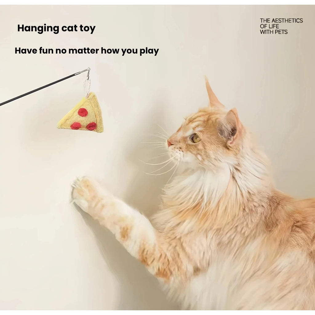 Cat playing with a hanging Meoof food-themed toy