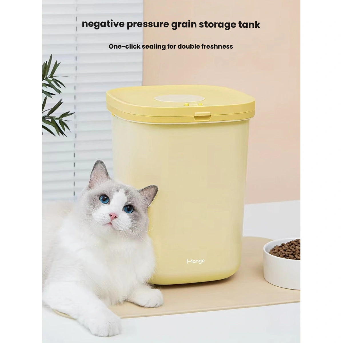 Yellow Mango food bin pictured beside a cat