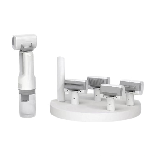 White cordless pet grooming vacuum brush with interchangeable heads