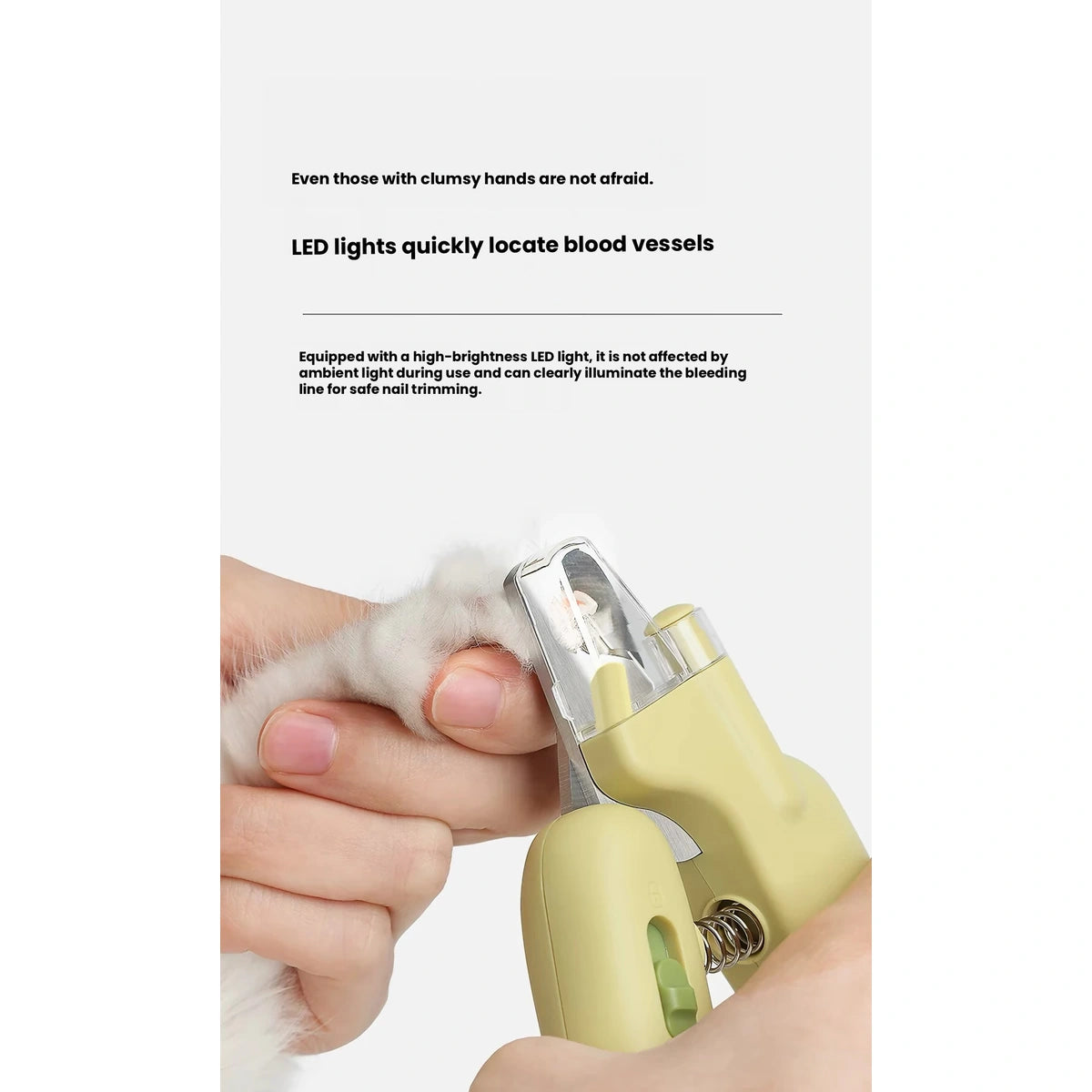 AIWO illuminated nail clippers close-up beside a pet paw