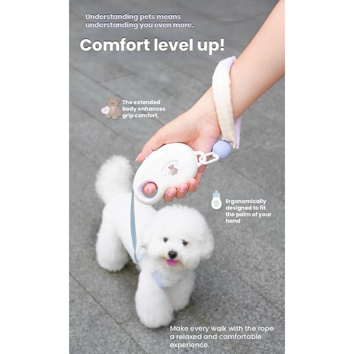 TuffHound retractable leash held while walking a small dog