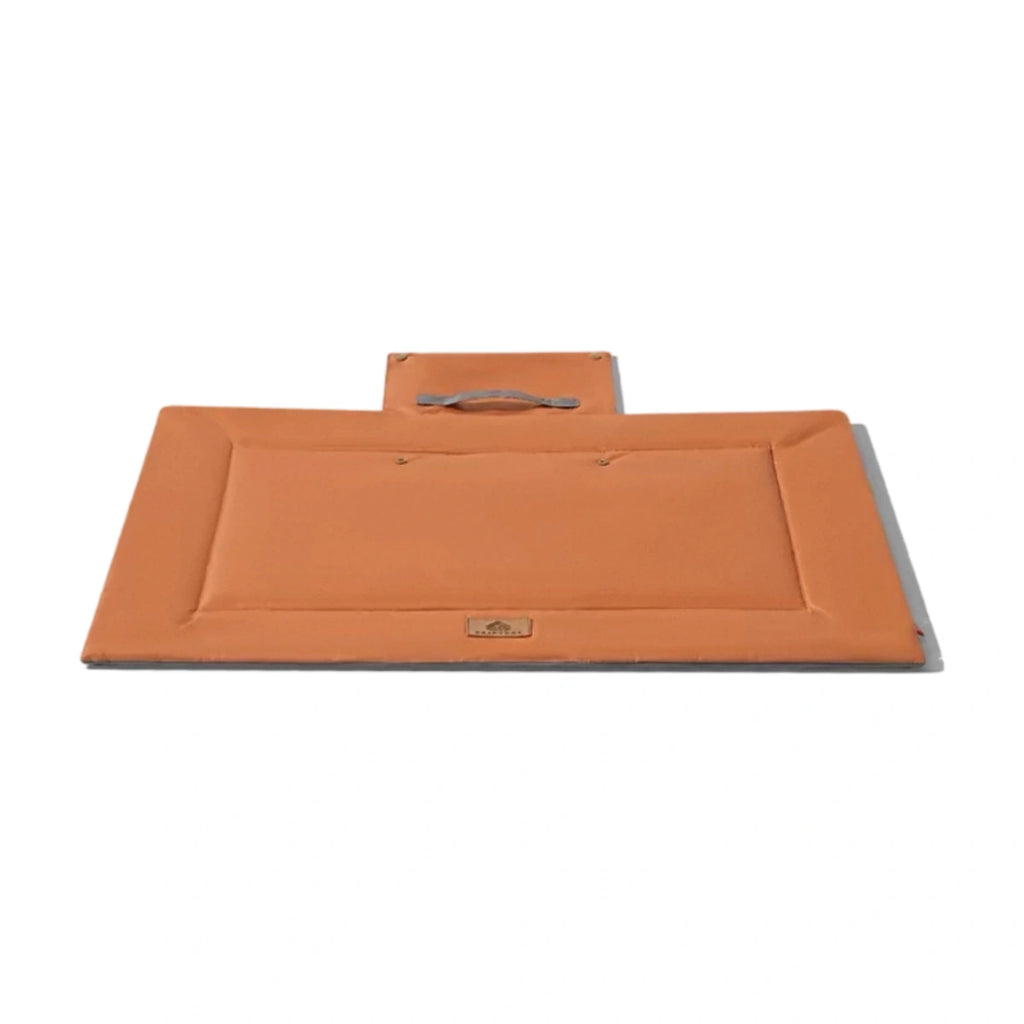 Orange Fairypet rectangular outdoor mat with a carry handle