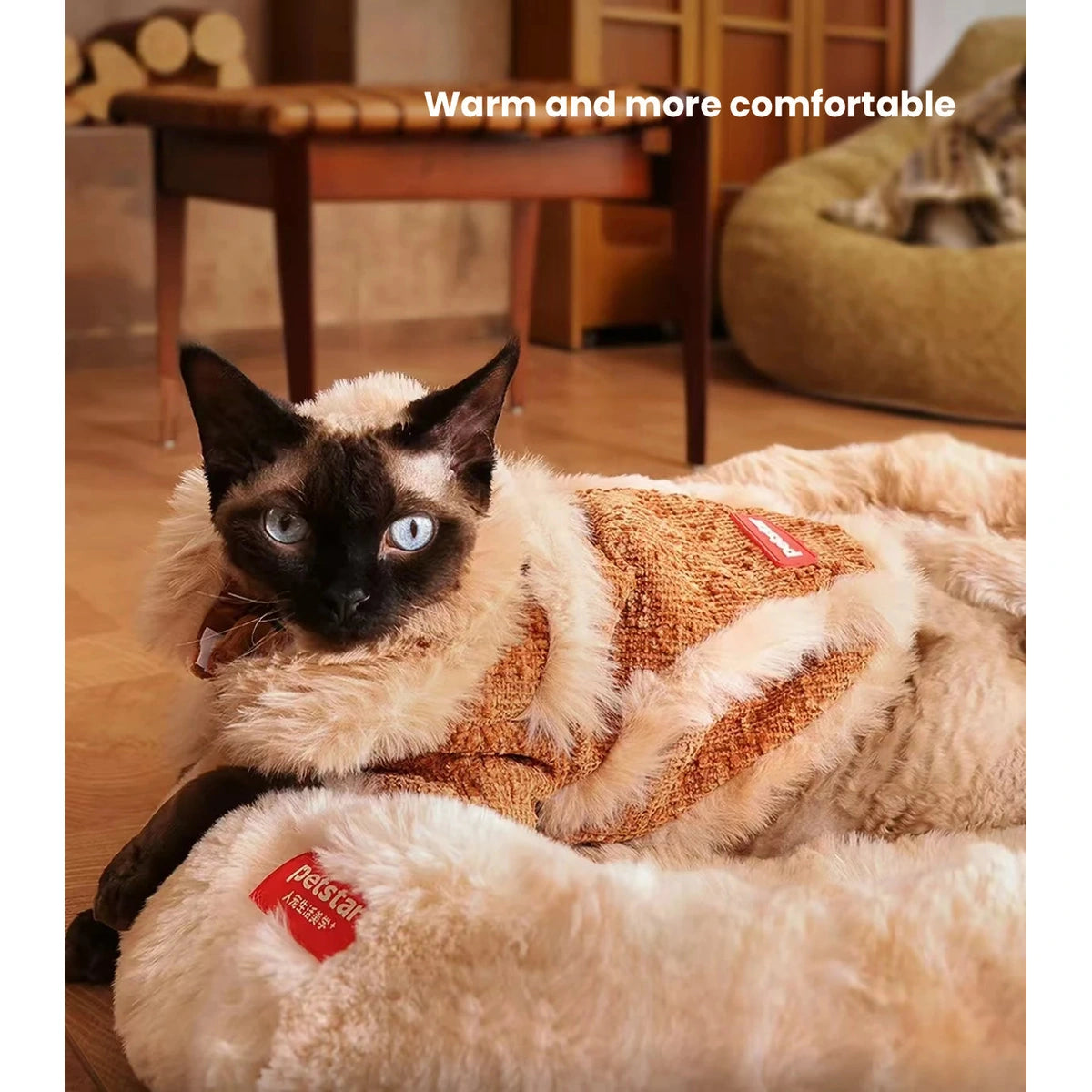 Cat resting while wearing the brown Petstar plush jacket