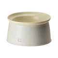 Cream inFluffy raised pet bowl with removable pale insert