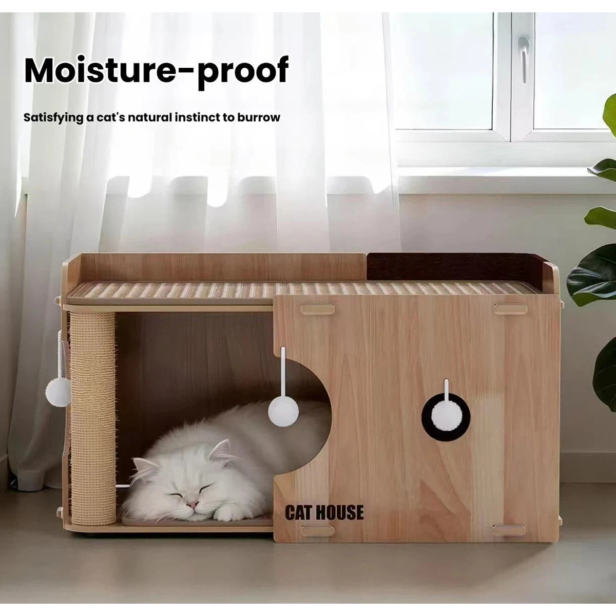 Cat sleeping inside the lower moisture-resistant cat bed compartment