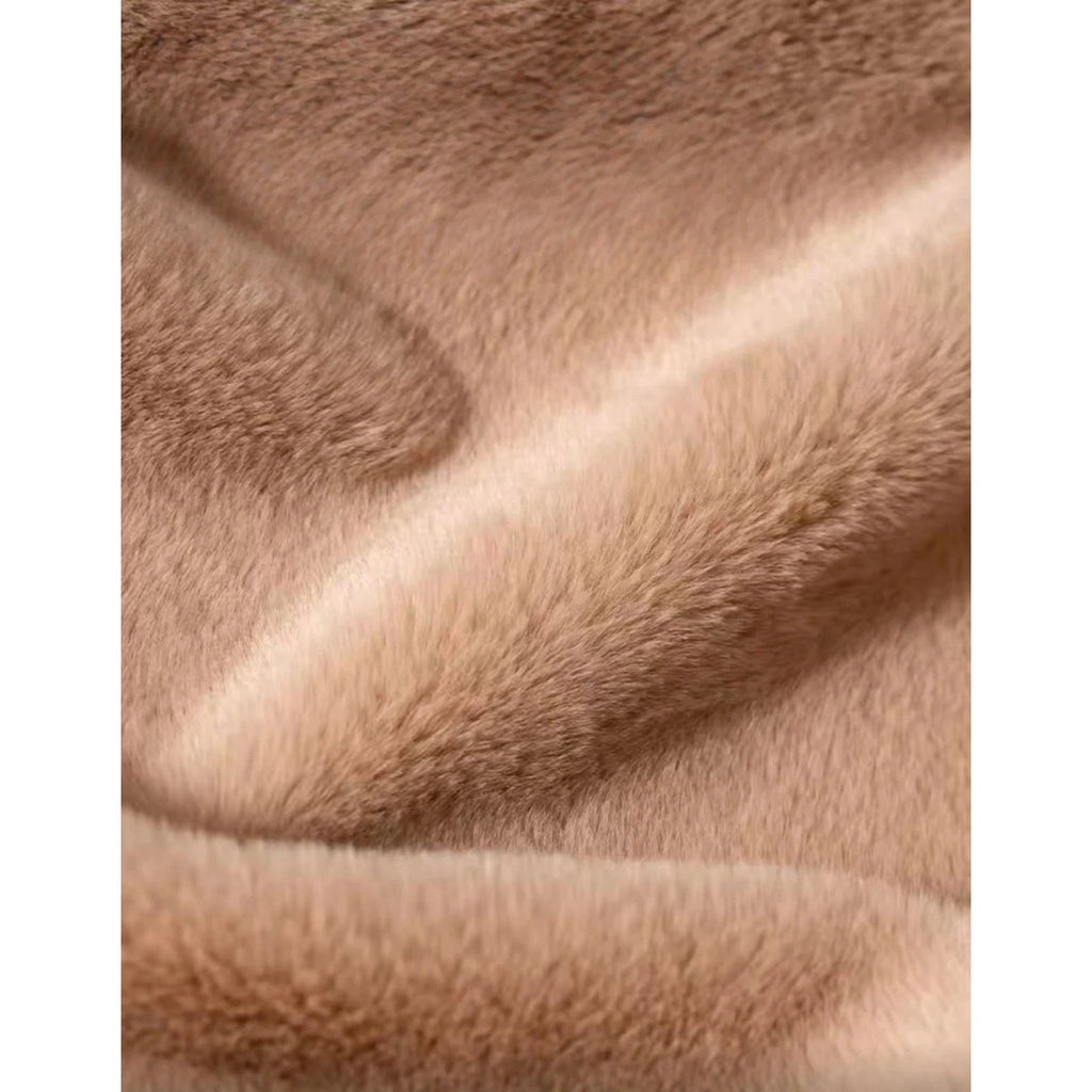 Close-up of the beige cat house’s plush fabric texture