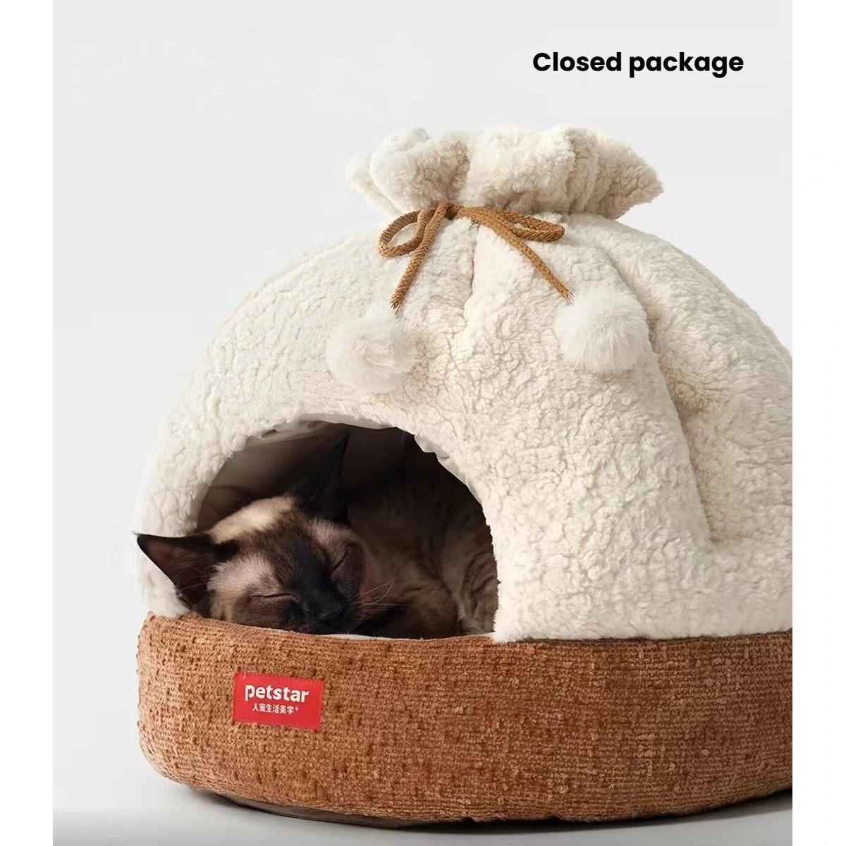 Close-up of a cat resting inside the Petstar plush cave bed