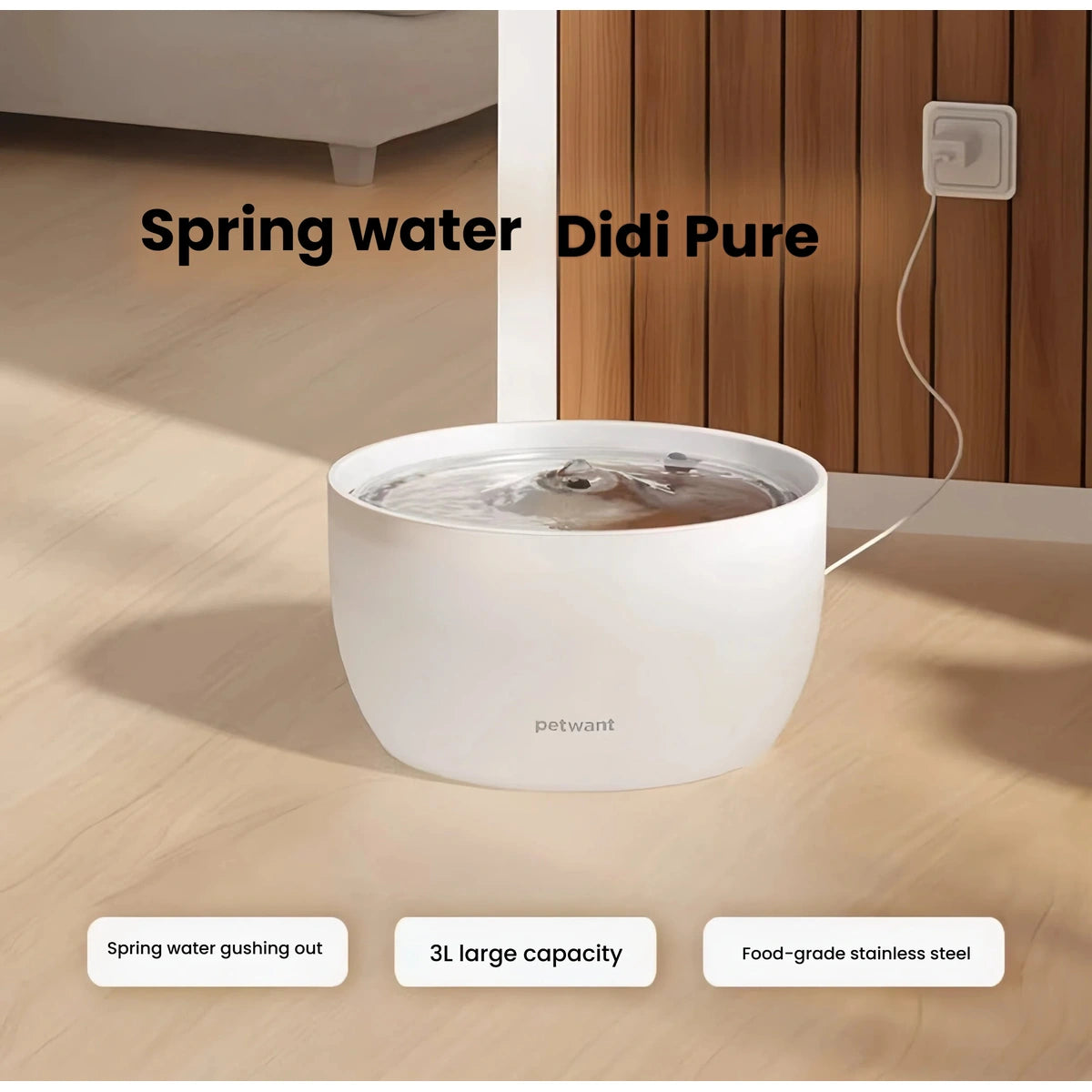 Petwant 3-litre cat fountain on a wooden surface with its power cable visible