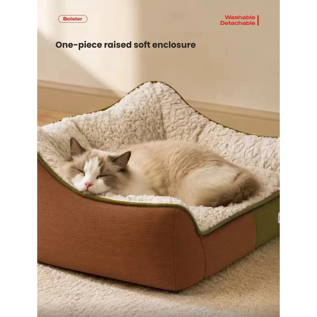 Cat resting against the raised side of the Petstar pet sofa