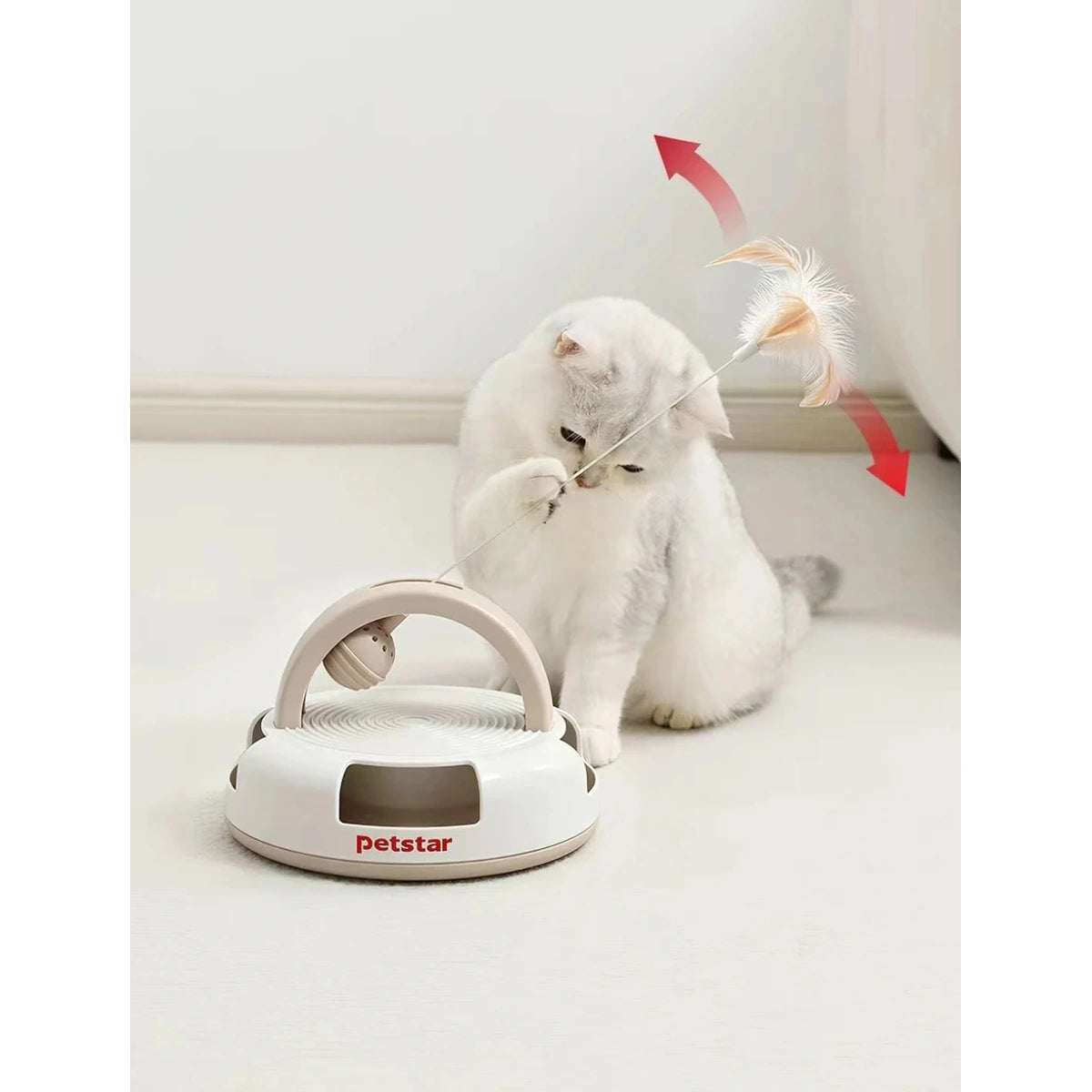 Cat batting the feather wand on a Petstar activity toy