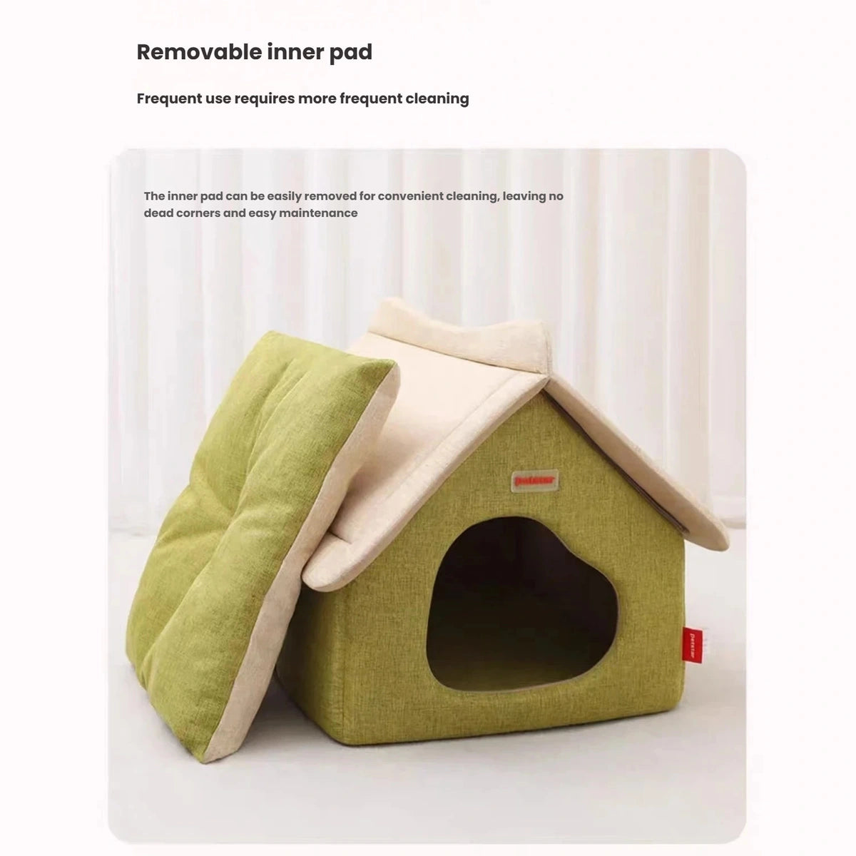 Petstar cat house beside its removable green inner cushion