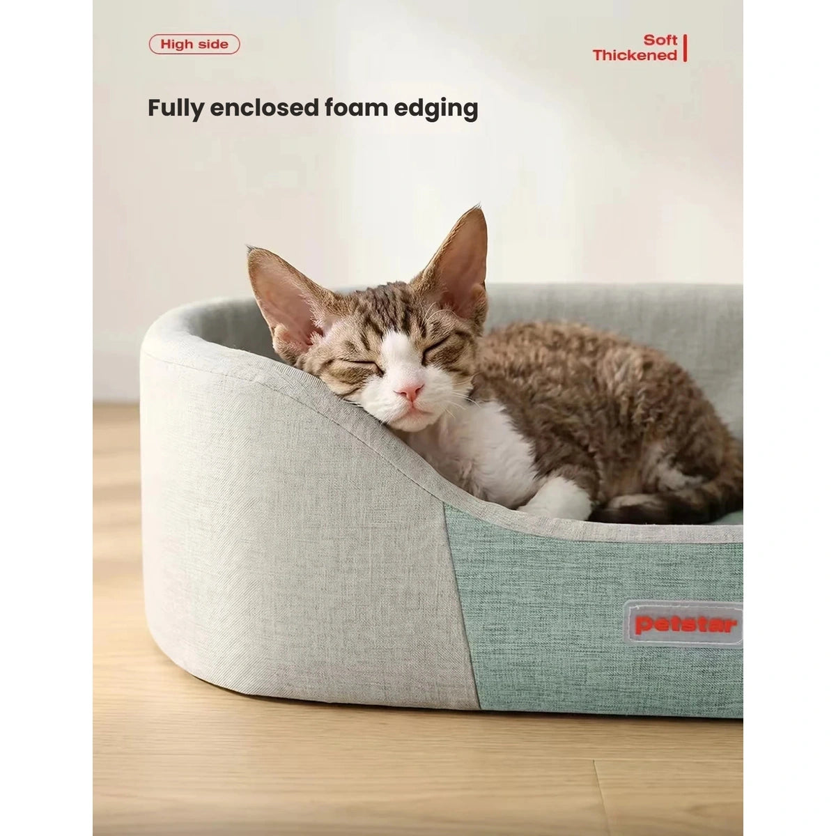 Close-up of a cat resting against the bed’s raised padded edge