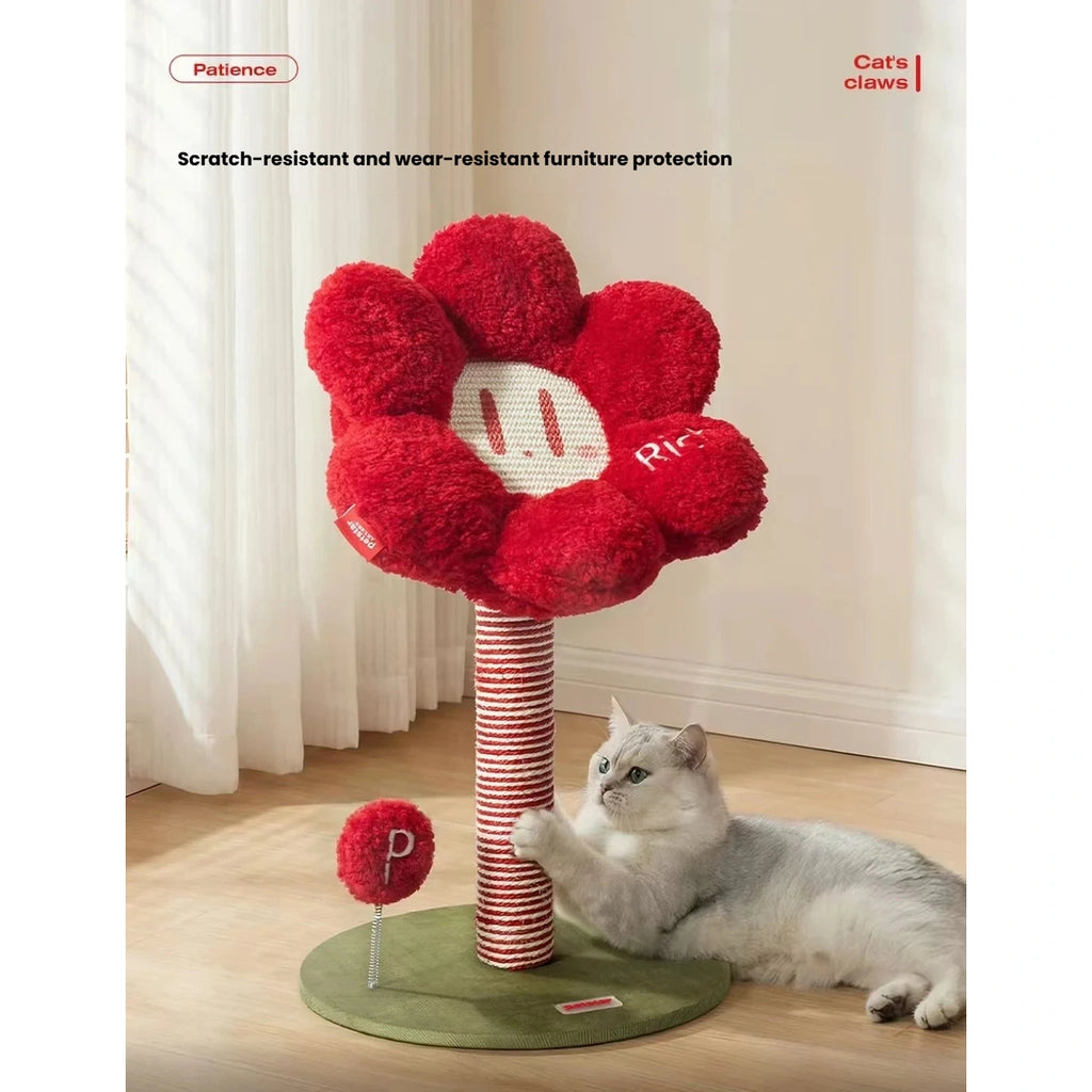 Cat reaching toward the play ball on the flower cat tree