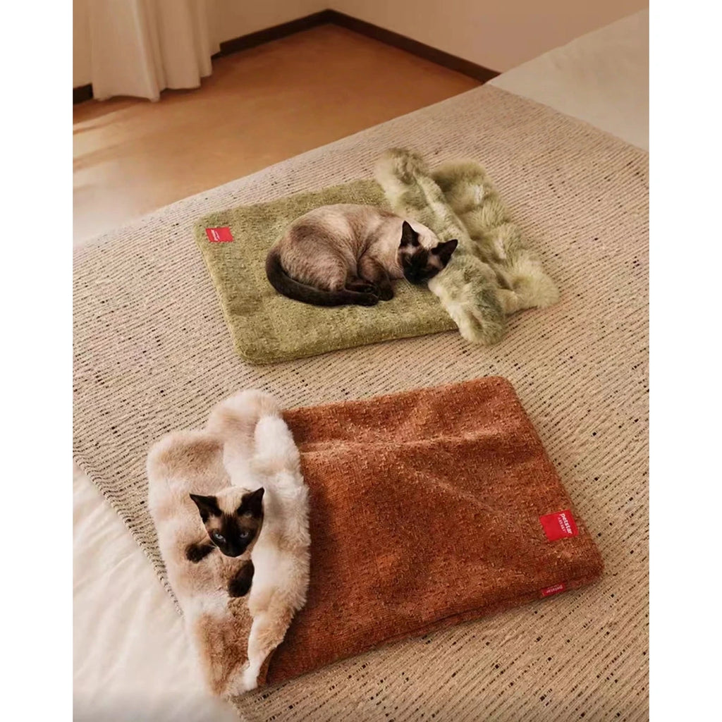 Brown and green Petstar cat bed mats with cats resting on them