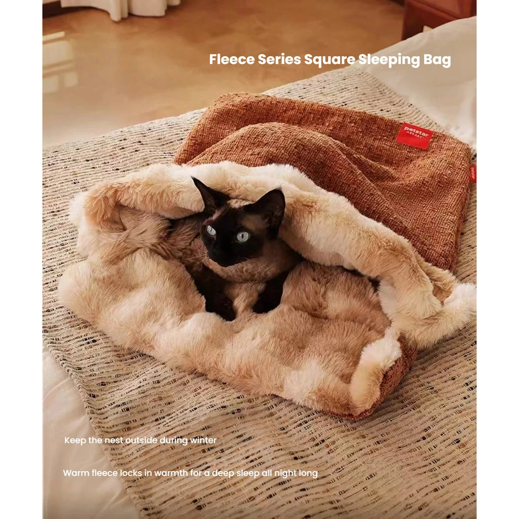 Cat curled against the plush rim of the Petstar bed mat