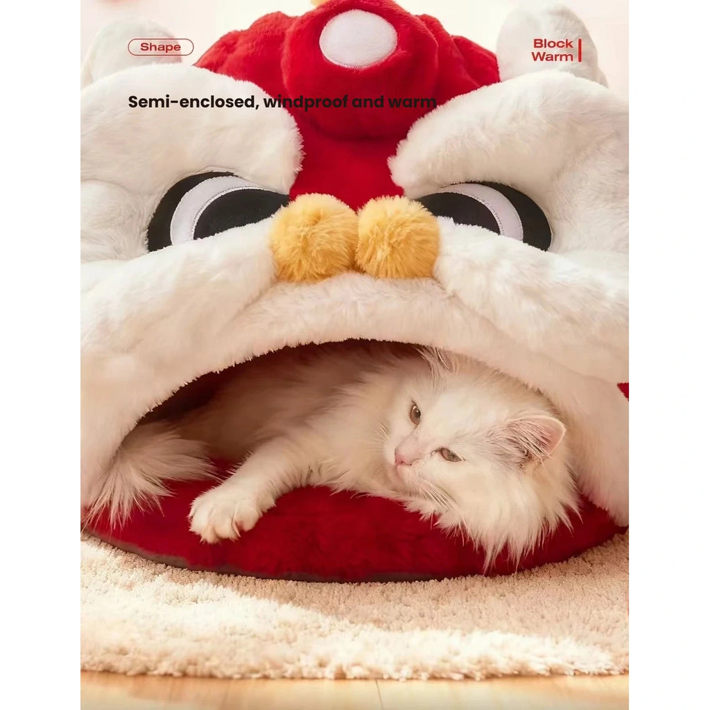 Cat curled beneath the soft roof of the Lion Dance bed