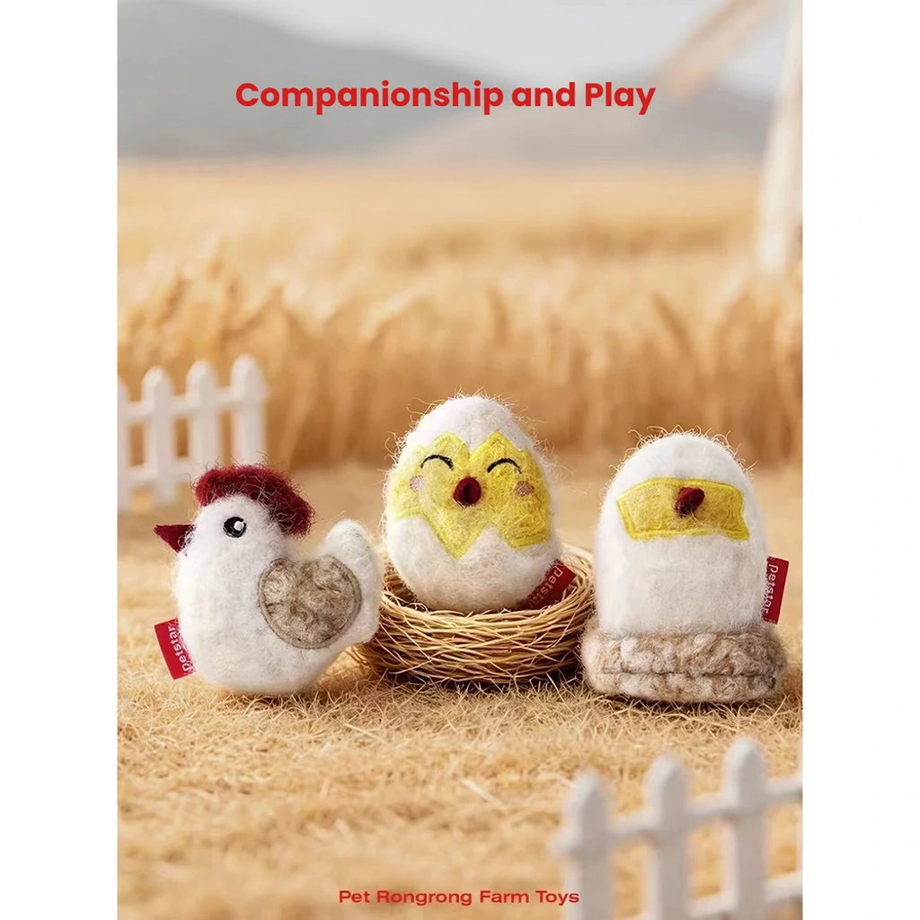 Chicken plush cat toys arranged in a small nest