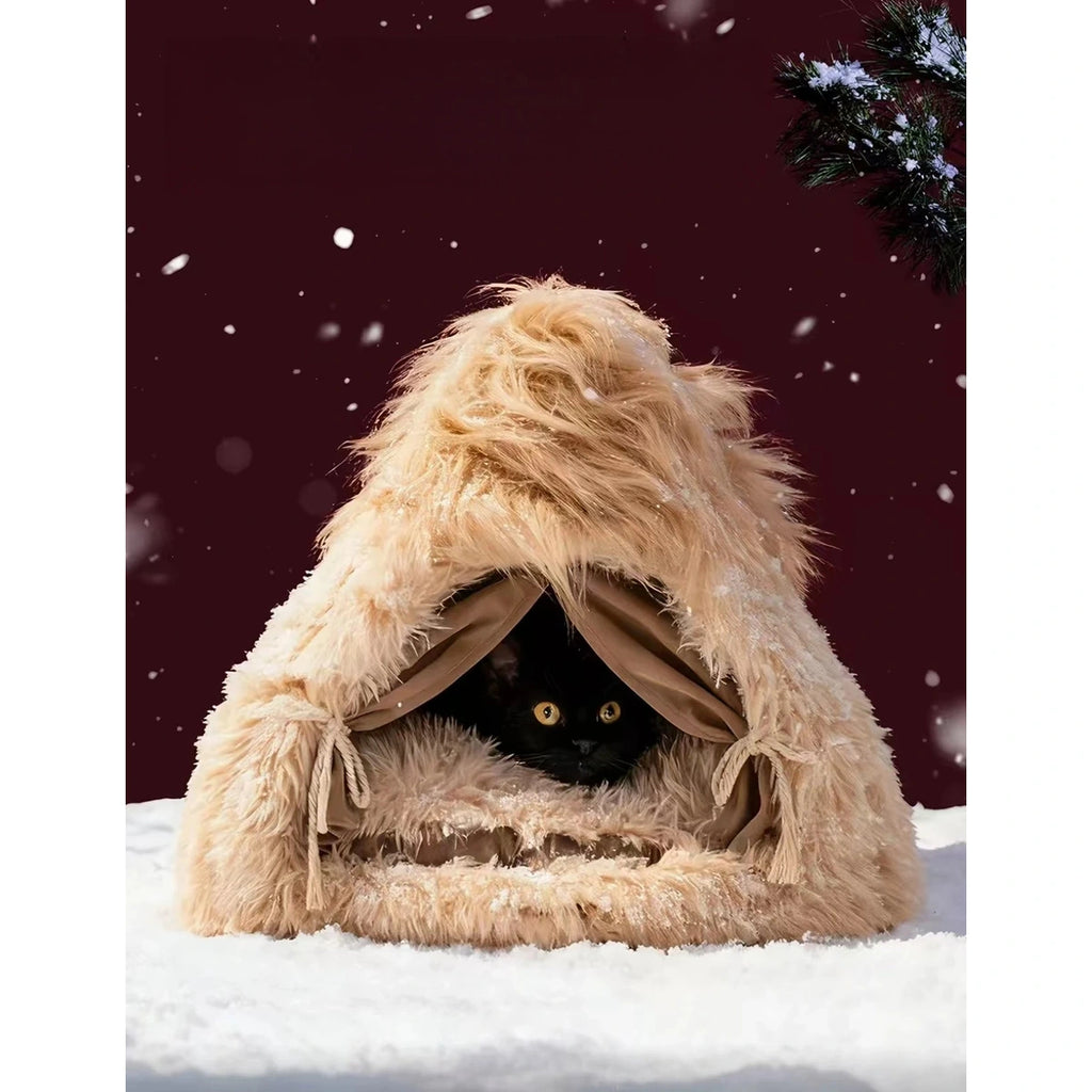 Cat resting inside the shaggy triangular cat bed