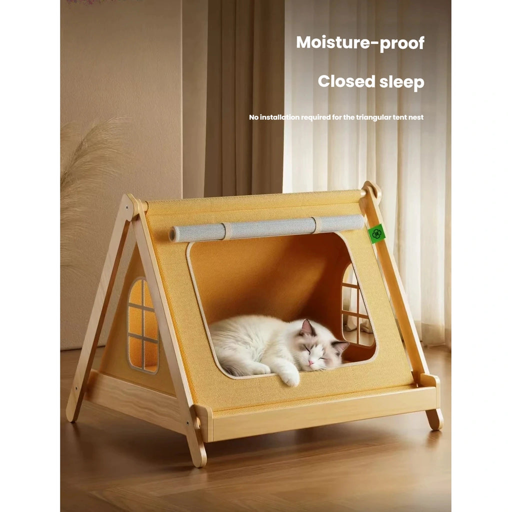 Cat resting inside the wooden tent bed