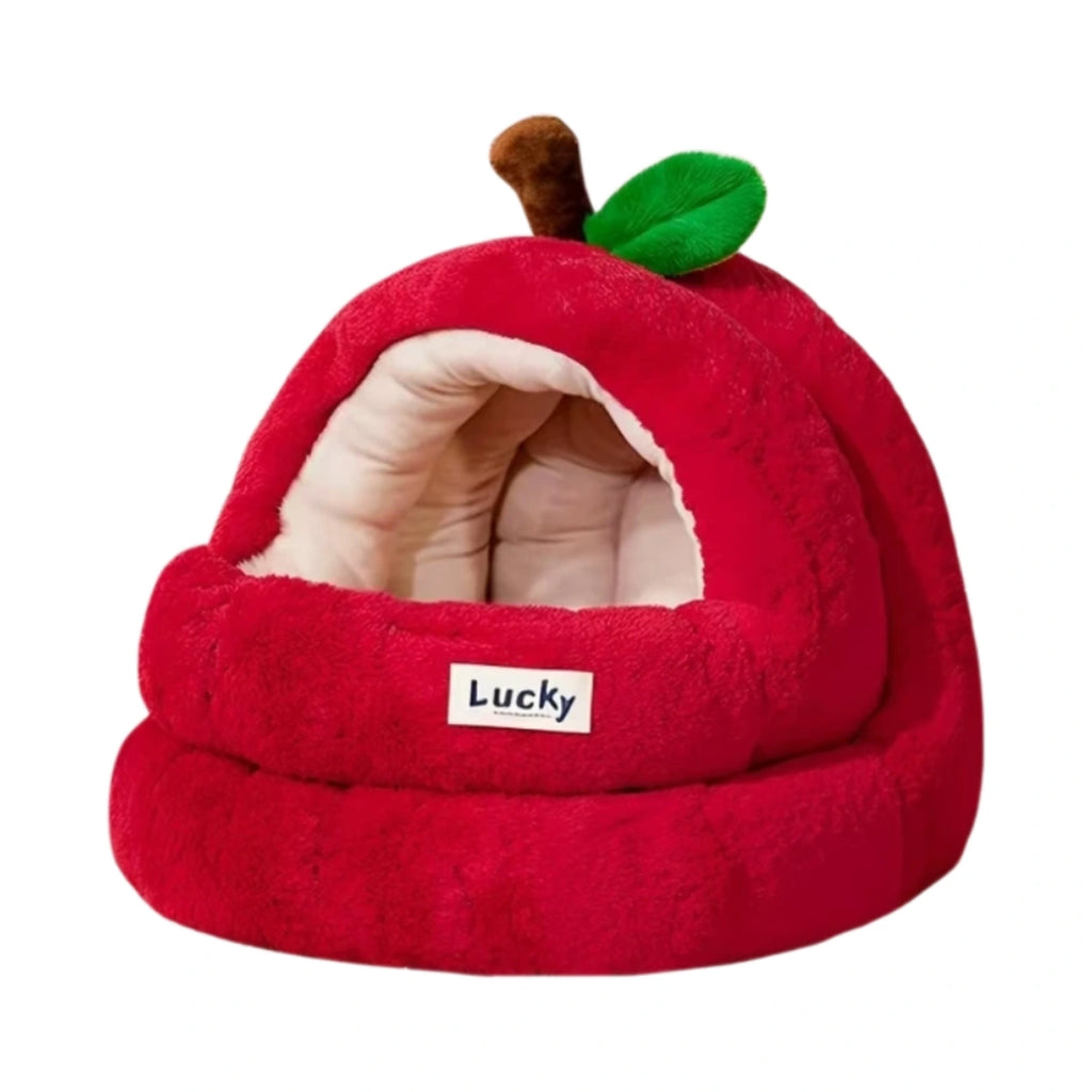 Red apple-shaped cave cat bed with a white cat inside