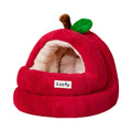 Red apple-shaped cave cat bed with a white cat inside