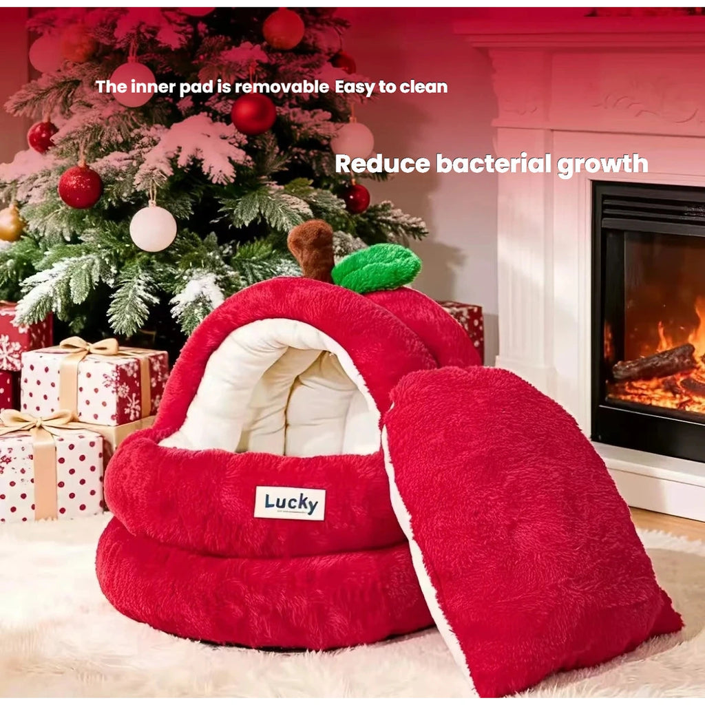 Red apple cave cat bed in a holiday room setting