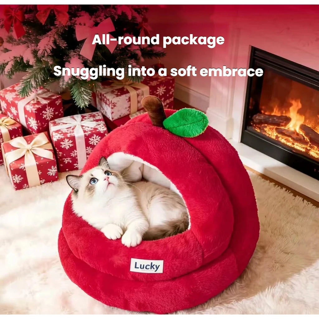 Cat tucked inside the enclosed red apple cat bed