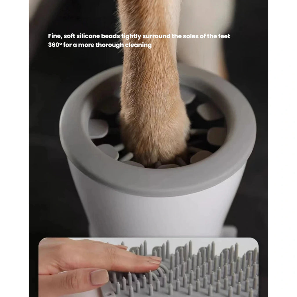 Pet paw inside the silicone brush of the cleaner cup